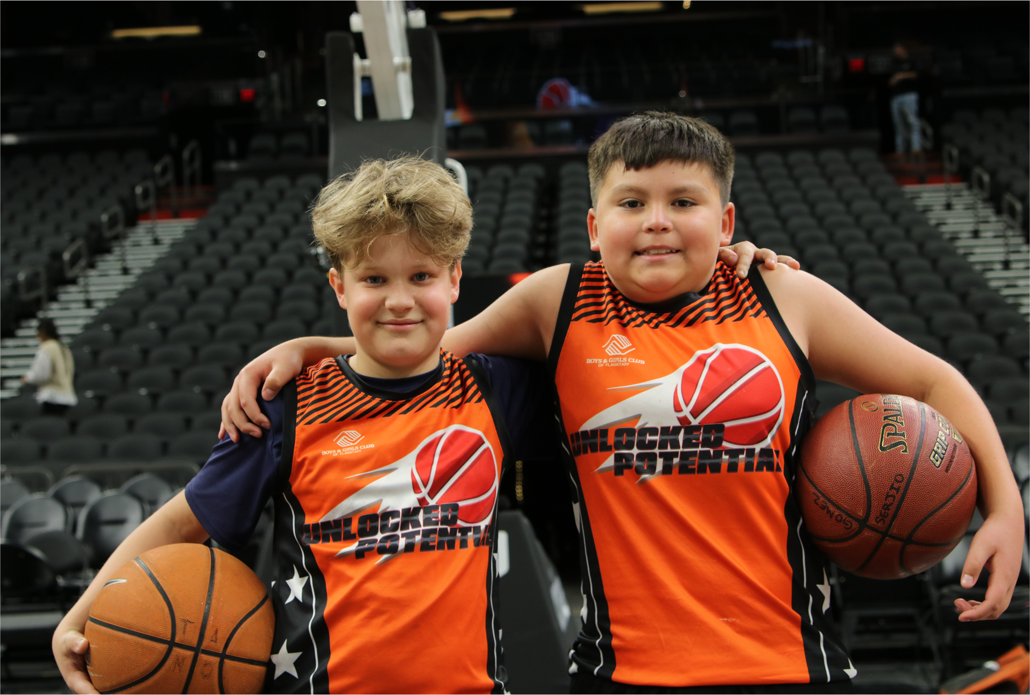A picture of Unlocked Potential Flag Elite youth basketball league teammates at the Phoenix Suns mortgage matchup arena.