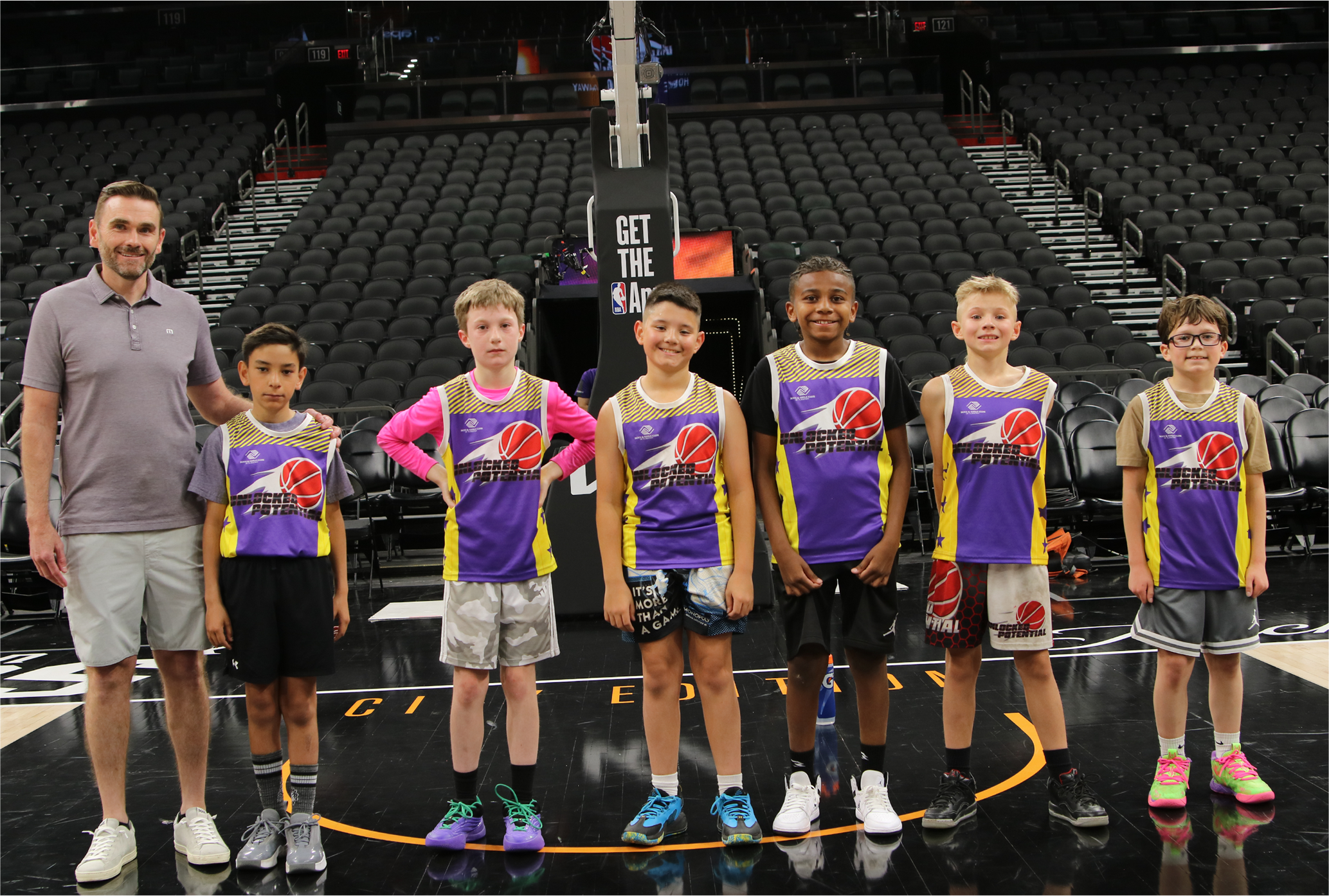 A picture of Unlocked Potential Flag Elite youth basketball league runners up at the Phoenix Suns mortgage matchup arena.