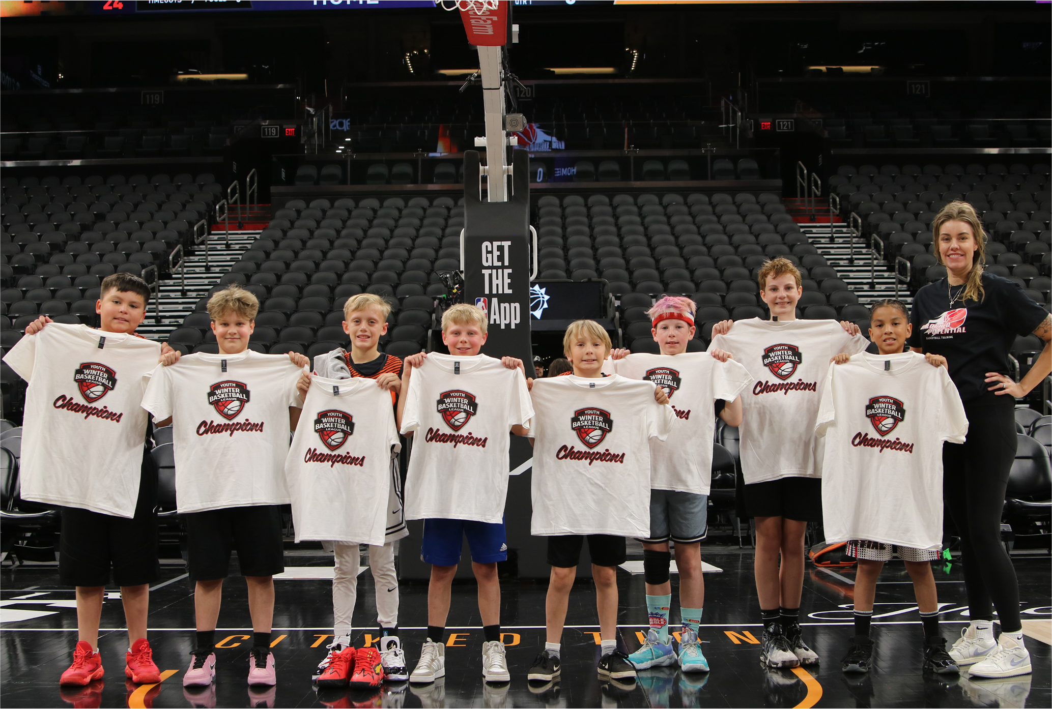 A picture of Unlocked Potential Flag Elite youth basketball league champions at the Phoenix Suns mortgage matchup arena.