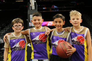 A picture of a youth basketball team playing in the Unlocked Potential Flag Elite youth winter basketball league championship.