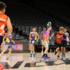 A picture of kids going on a fast break playing at the Unlocked Potential winter league championship.