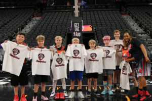 A picture of a youth basketball team that won in the Unlocked Potential Flag Elite youth winter basketball league championship.