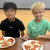 Two children attending the Unlocked Potential winter break youth camp.
