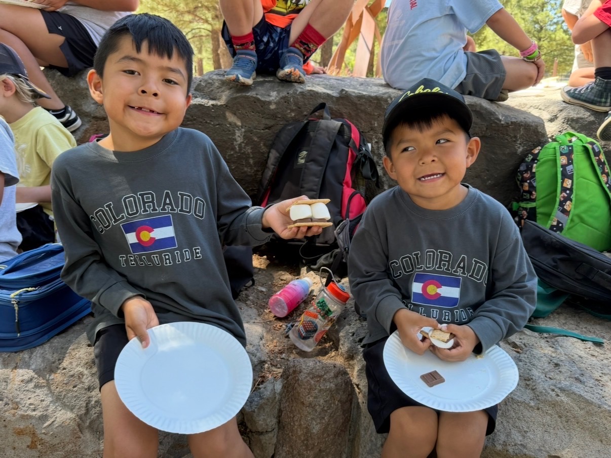 A picture of kids at unlocked potential summer youth camp in flagstaff eating