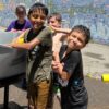 A picture of kids at unlocked potential summer youth camp in flagstaff having a water gun fight