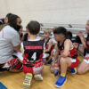 Coach Kiki coaching Unlocked Potential's youth basketball travel team
