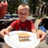 A picture of a child eating a s'more at the Unlocked Potential back to school fun bash camp in Flagstaff, AZ