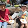 A picture of two kids eating s'mores at the Unlocked Potential back to school fun bash camp in Flagstaff, AZ